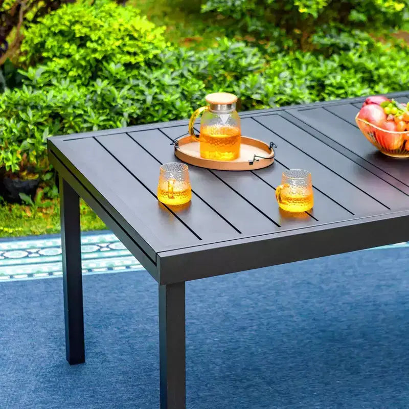 Set da patio da 9 pezzi con tavolo allungabile in acciaio e sedie a fionda impilabili - Captiva Designs: Sala da pranzo all'aperto, resistente alle intemperie