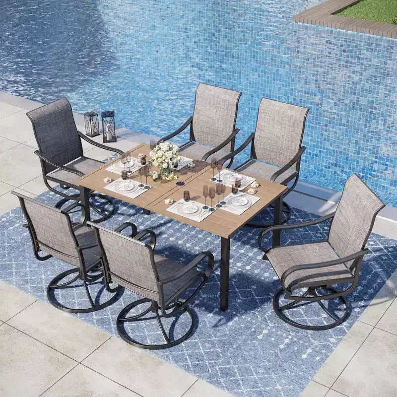 Captiva Designs Set da pranzo da 7 pezzi da esterno con tavolo rettangolare in acciaio, foro per ombrellone e sedie girevoli in Textilene