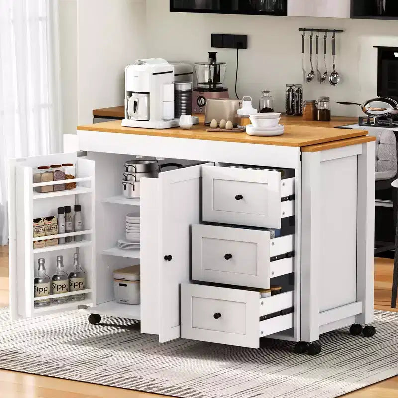 MAYEERTY Isola Cucina con Tavolo da Pranzo, 3 Cassetti, Presa Elettrica, Isola Cucina Rotante su Ruote con Porta Spezie e Mobile a 2 Ante per Cucina, Bianco