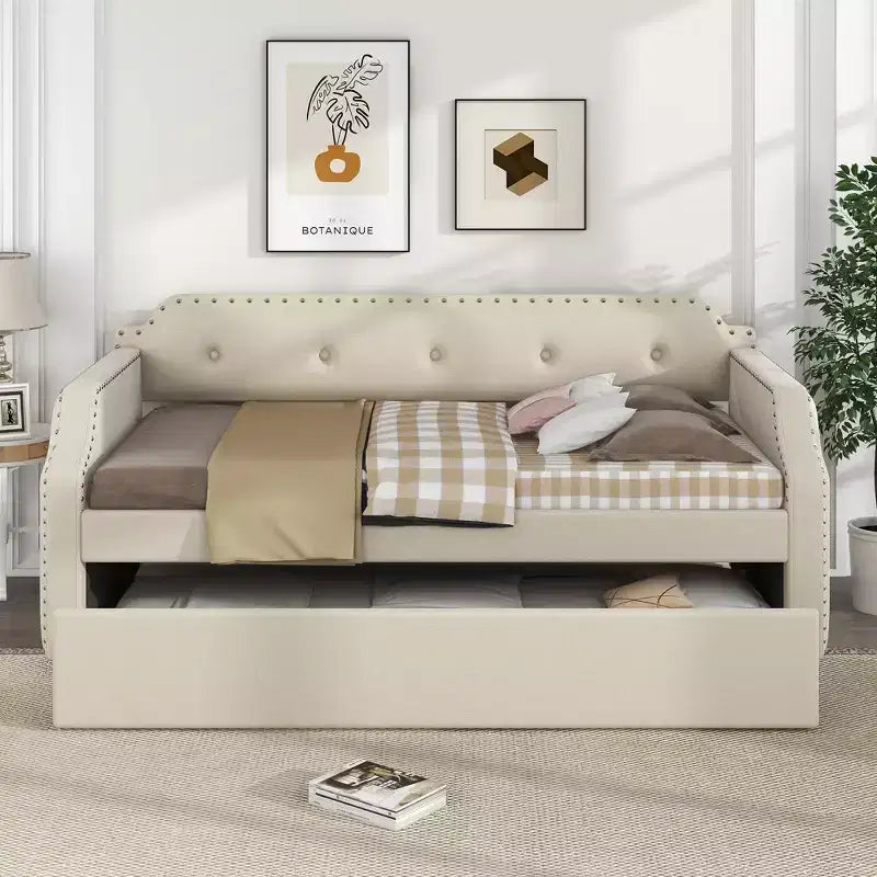 Divano letto imbottito singolo con letto estraibile e schienale trapuntato, in lino con finiture borchiate