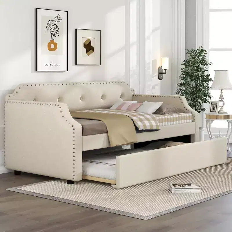 Divano letto imbottito singolo con letto estraibile e schienale trapuntato, in lino con finiture borchiate