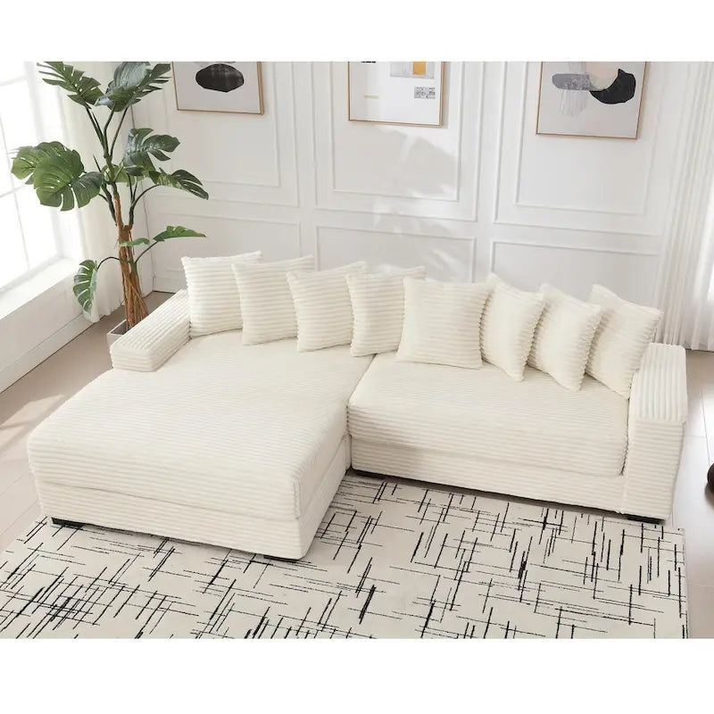 Divano componibile a L in velluto a coste beige 111 con chaise longue oversize sinistra e 8 cuscini decorativi