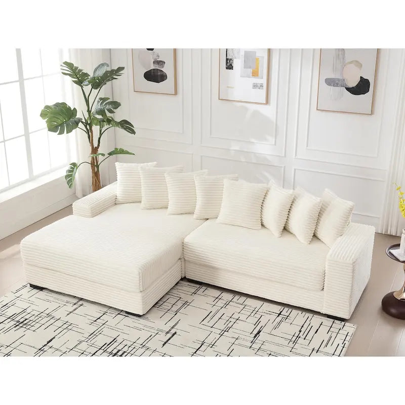 Divano componibile a L in velluto a coste beige 111 con chaise longue oversize sinistra e 8 cuscini decorativi