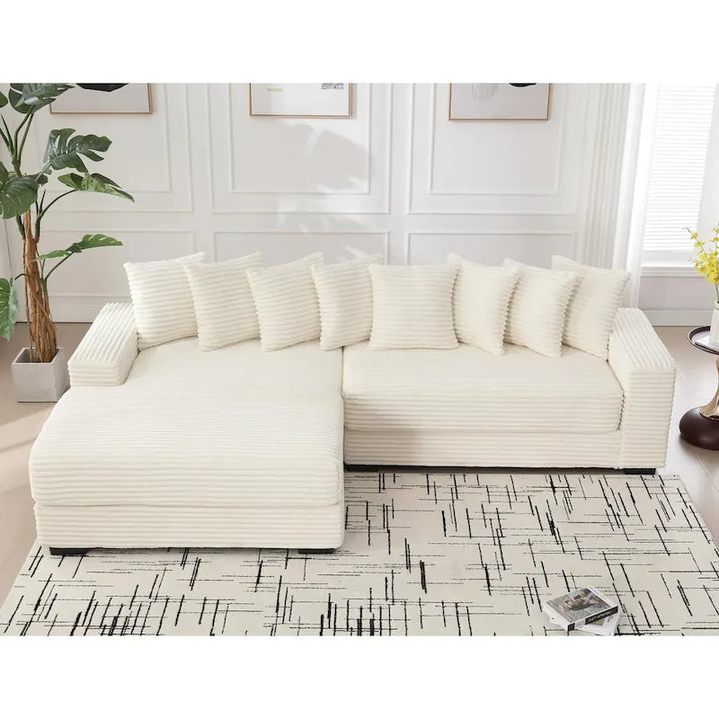 Divano componibile a L in velluto a coste beige 111 con chaise longue oversize sinistra e 8 cuscini decorativi