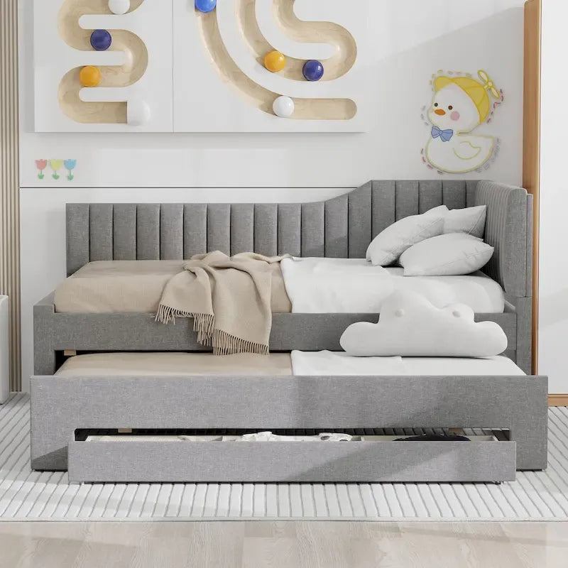 Letto a una piazza e mezza imbottito con letto estraibile e tre cassetti, grigio