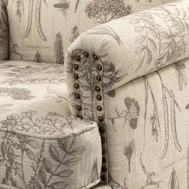 Poltrona transizionale Yahweh in legno e tappezzeria con fantasia floreale, braccioli a pannello e schienale a gobba di cammello | ART OF LIVING DESIGNS